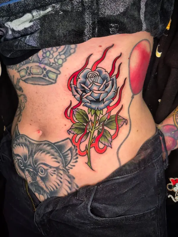 Traditional flaming rose by Chris Carp at Heart & Sword Tattoo