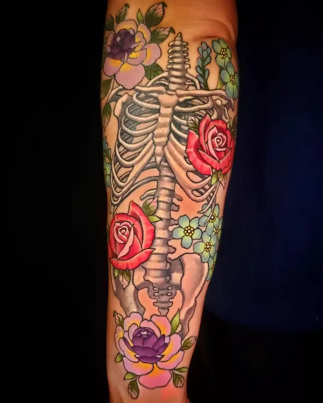 Color skeleton with roses and flowers by Chris Carp at Heart & Sword Tattoo