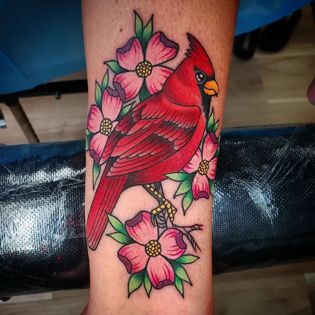 Cardinal and dogwood flowers by Chris Carp at Heart & Sword Tattoo