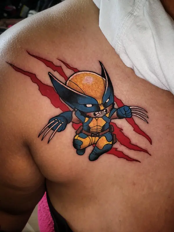 Chibi clawed superhero on shoulder by Chris Carp at Heart & Sword Tattoo