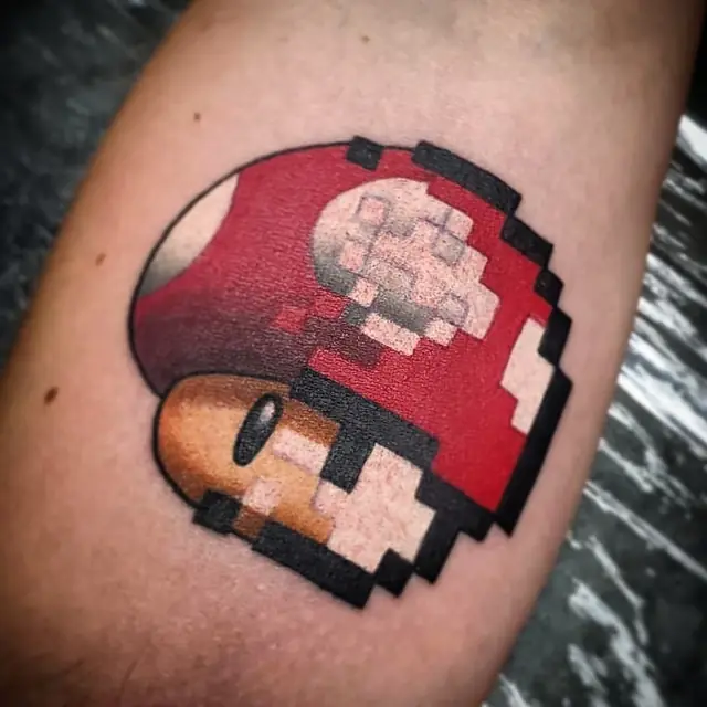 Pixel-art video game mushroom by Chris Carp at Heart & Sword Tattoo