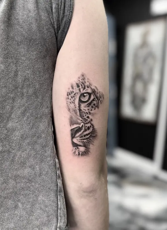Black and gray leopard tattoo by Dina at Heart & Sword Tattoo
