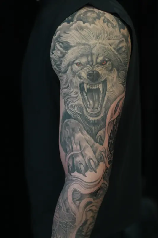 Black and gray wolf sleeve by Johnny at Heart & Sword Tattoo